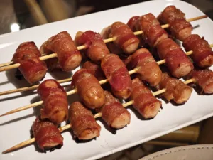 Cremwurst in bacon