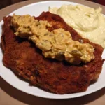 Snitel de porc cu sos de mustar